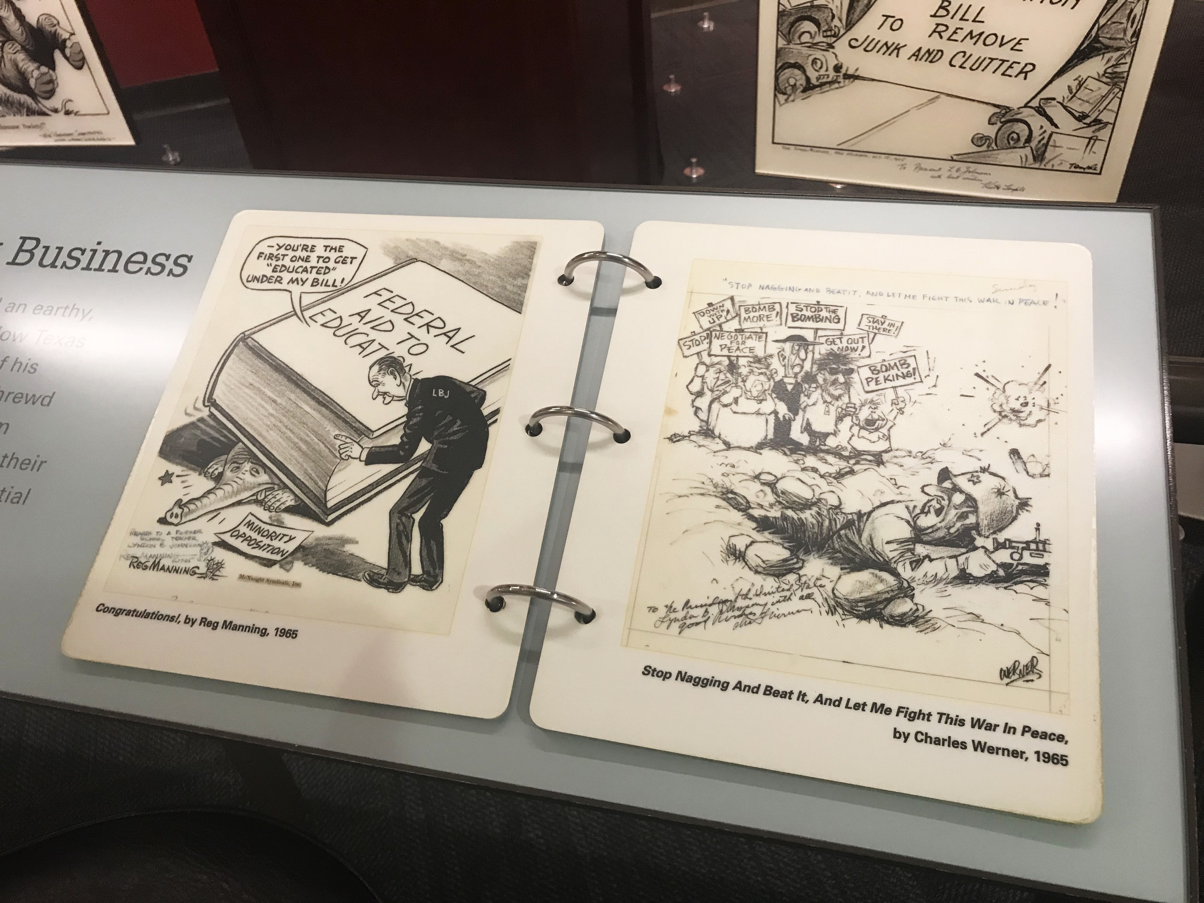 A view of the political cartoons on view in the LBJ Humor's exhibition at the LBJ Library.